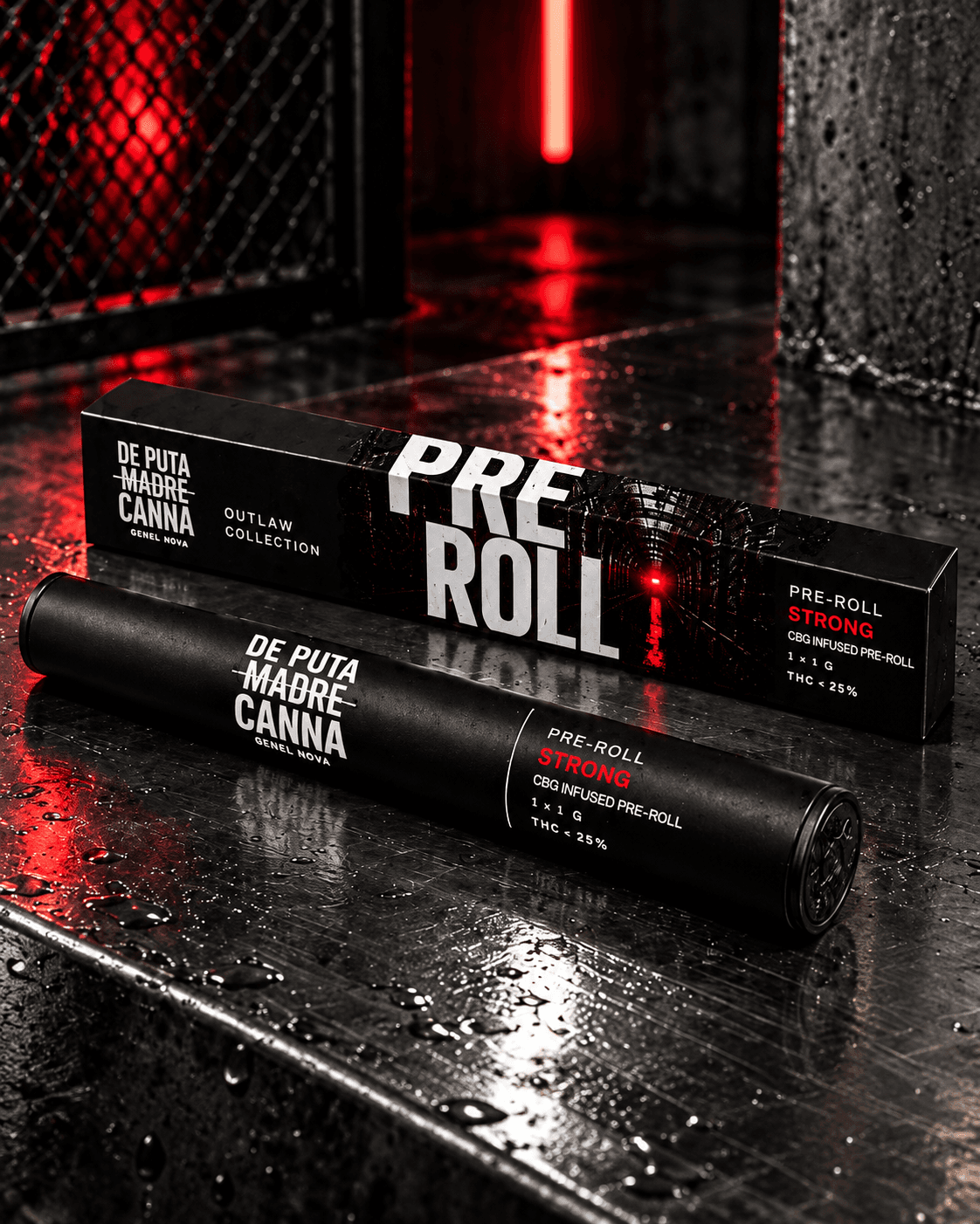 A black pre-roll tube in front of its box on wet steel under red light