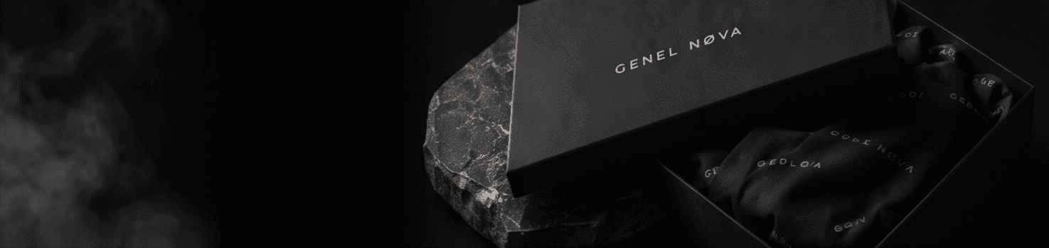 A numbered box set open on marble, the contents wrapped in printed tissue